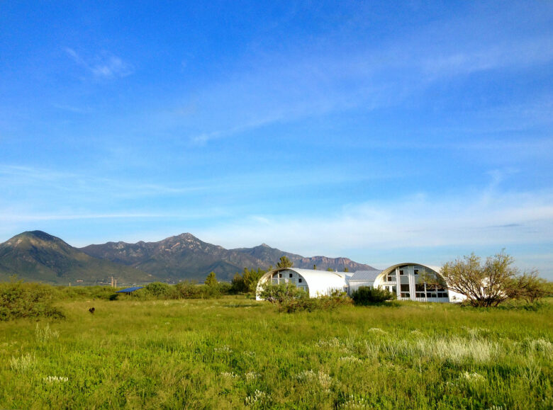 Eco-friendly metal home in the middle of a field