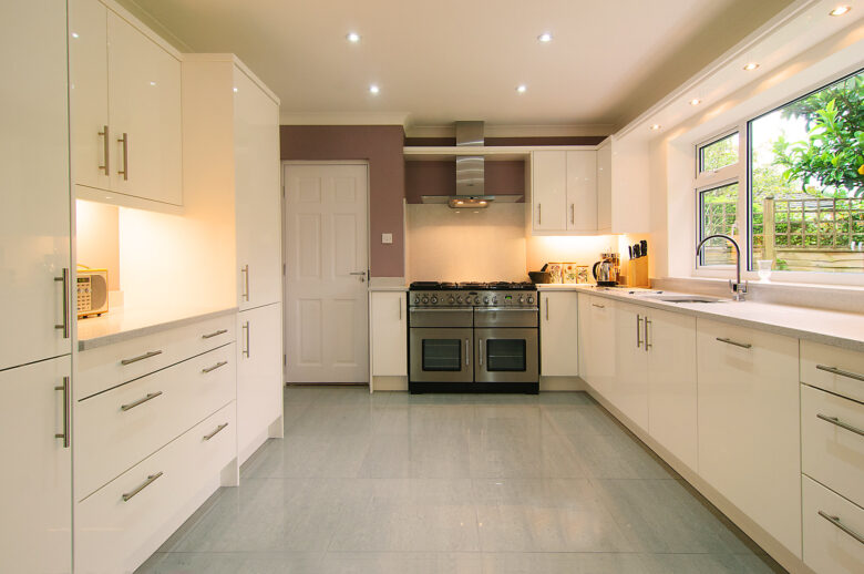 Spacious white kitchen with modern appliances