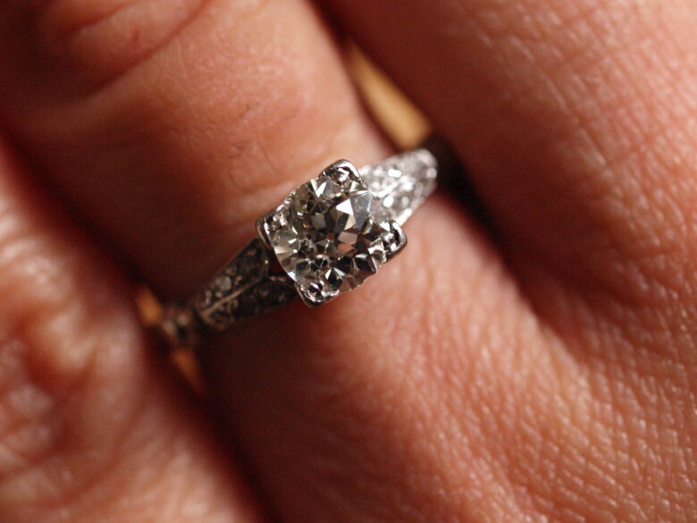 Diamond engagement ring on a ring finger