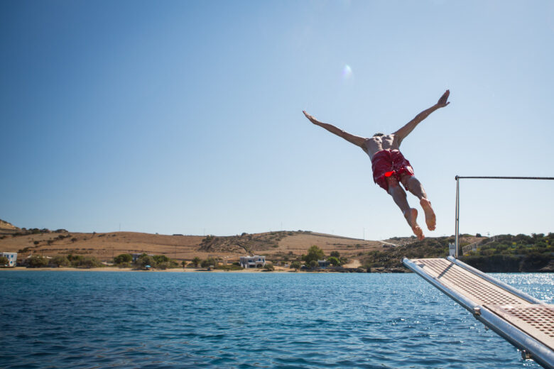 Man diving off a boat in the South Aegean Sea