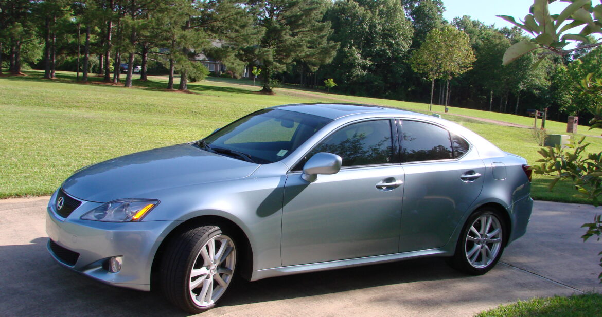 New silver car parked up in a driveway