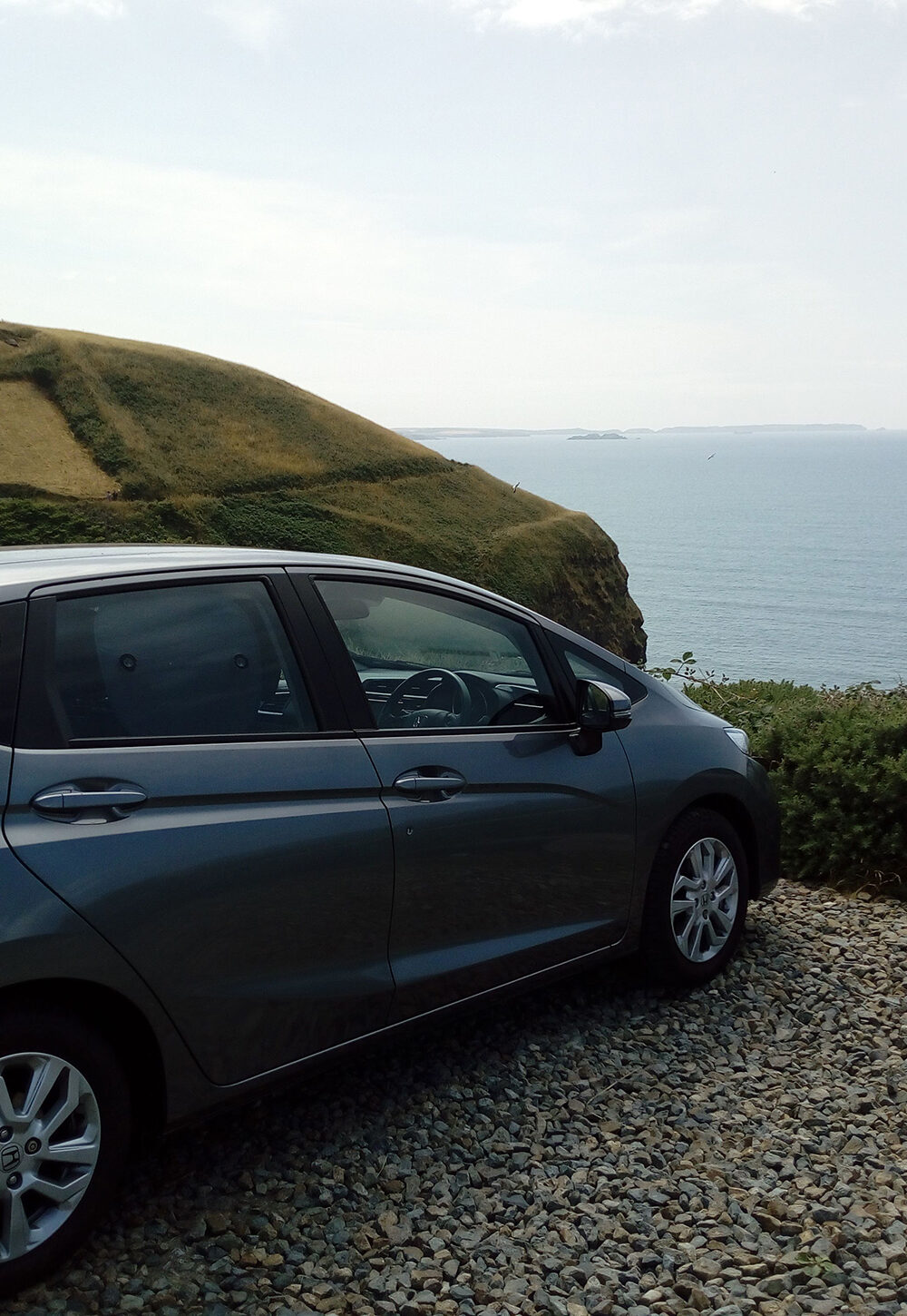 Car parked overlooking the sea