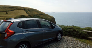 Car parked overlooking the sea