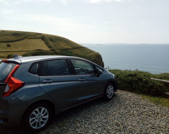 Car parked overlooking the sea