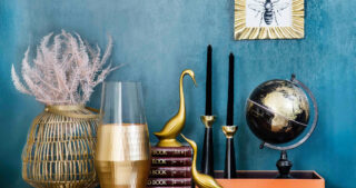 Collection of vases, candles and decorations on a shelf